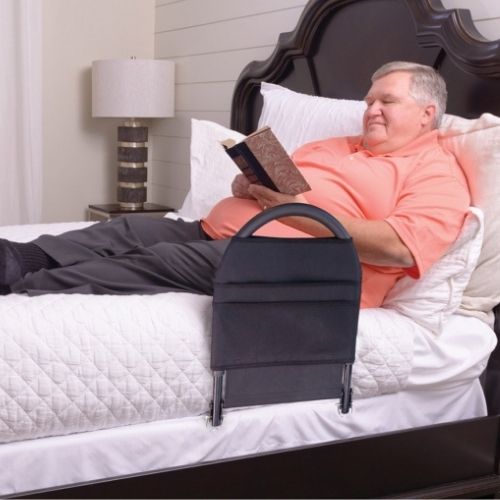 Image of the Bed Rail Advantage guarding a man while he is lying on the bed.