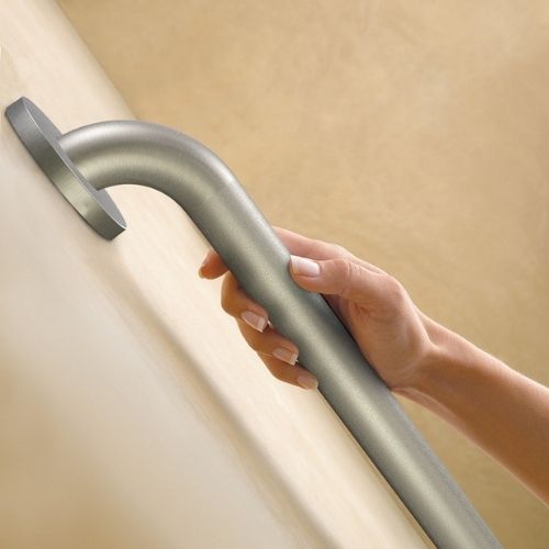 Image of the Peened Grab Bar on the wall with hand using it.