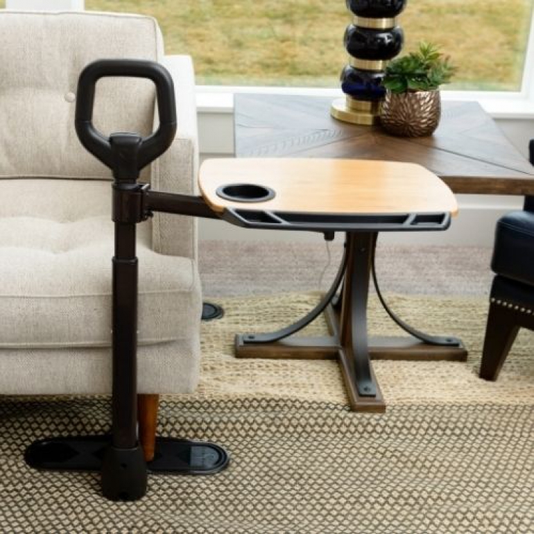 Image of the Assist-A-Tray by a couch.