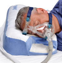 Image of a man with a CPAP mask on using the CPAP Pillow 2.0 product. thumbnail