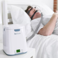 Image of man sleeping with SoClean near. thumbnail
