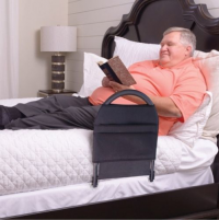 Image of the Bed Rail Advantage guarding a man while he is lying on the bed. thumbnail