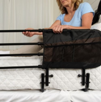 Woman extending the Stander EZ Adjust Bed Rail. thumbnail